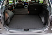 Huge, Clean And Empty Car Trunk In Interior Of Compact Suv. Rear View Of A SUV Car With Open Trunk