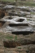 Tombs in the Tuvixeddu necropolis. Punic burials with deep rock-cut tombs in Cagliari in Sardinia.