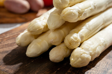 Wall Mural - New harvest of high quality German white asparagus washed, uncooked, tasty vegetarian dinner