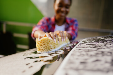 Wall Mural - Woman using sponge with foam closeup, car wash