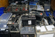 Pallet with many used car batteries for recycling