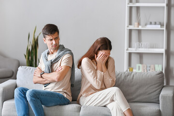 Poster - Crying young woman after quarrel with her husband at home