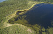 © Serg Zastavkin - Aerial photo of forest boggy lake in the Karakansky pine forest near the shore of the Ob reservoir.