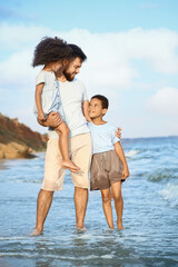 Poster - Little children with father on sea beach