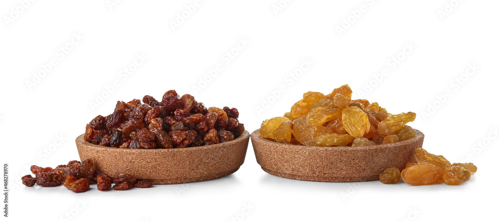 Bowls with different sweet raisins on white background