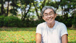 Portrait of healthy happy senior asian old man in the park outdoors exercise stretching his arms. Spring healthcare lifestyle grandfather retirement wellness healthy, Chinese old men concept