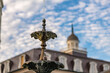 Close up on the fountain in front of the Presbytere and the famous St. Louis Cathedral in Jackson Square. Shallow focus on the edge of the fountain for effect.