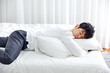 © 이 상신 - An office worker in his 30s who is sleeping on a weekend bed.