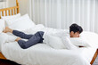 © 이 상신 - An office worker in his 30s who is sleeping on a weekend bed.