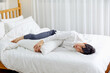 © 이 상신 - An office worker in his 30s who is sleeping on a weekend bed.