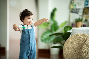 happy son child baby playing at home by supporting with family father and mother