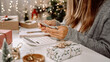 © Anna - Girl counting US Dollar bills, using calculator, and writing expenses. Woman doing budget, estimating money balance for shopping spree. Female accountant paying taxes. Girl counting Christmas gifts.