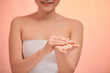 Woman applying moisturizing hands with cream,