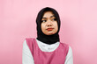 © MunirSr - Closeup of beautiful cheerful young Muslim woman, looking at empty space, presenting something, isolated