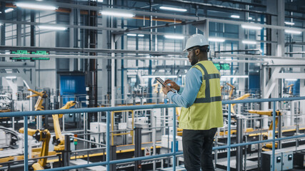 Aufkleber - African American Car Factory Engineer in High Visibility Vest Using Tablet Computer. Automotive Industrial Manufacturing Facility Working on Vehicle Production on Automated Technology Assembly Plant.
