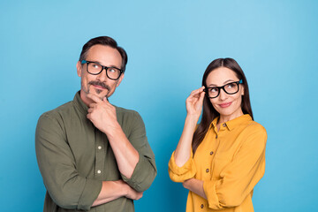 Sticker - Photo of minded pretty lady handsome man look interested empty space isolated on blue color background