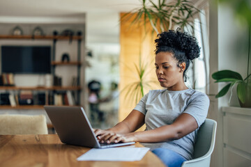 Hardworking adult woman, using her laptop, for work