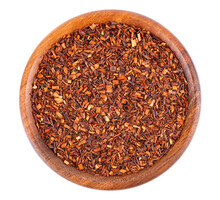 Rooibos Red Tea In Wooden Bowl, Isolated On White Background. Traditional Herbal And Organic Tea. Top View.