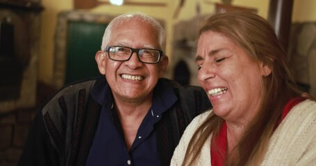 Wall Mural - Happy latin senior couple smiling 