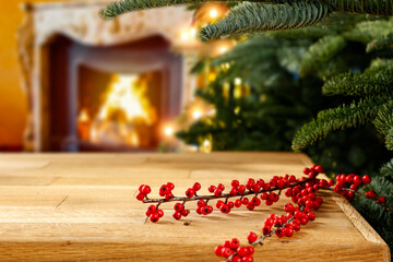 Wall Mural - Wooden table in Christmas evening with a vacant place and a Christmas tree setting 