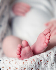 Sticker - Close up photography of baby toes and feet. Body out of focus.