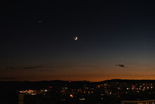 Waxing Crescent Moon Over City