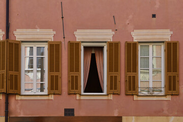 Poster - Detail of the façade of an old building with three windows in a row, Alassio, Savona, Liguria, Italy