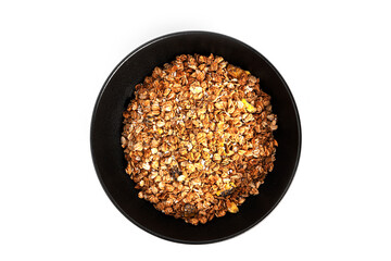 Granola from whole oat flakes with coconut chips, pineapple and chia seeds isolated on a white background. Muesli isolated. A quick breakfast. Healthy breakfast.