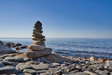 Fototapeta Desenie - stack of stones on beach