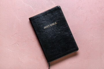 Holy Bible book on pink background