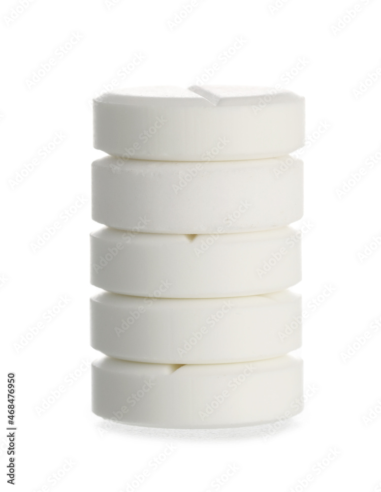 Stack of vitamin K pills on white background