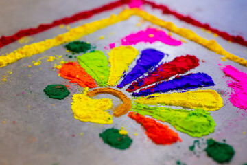 Indian pre wedding haldi ceremony colourful powder mosaic close up