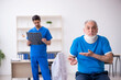 © Elnur - Old male patient visiting young male doctor radiologist
