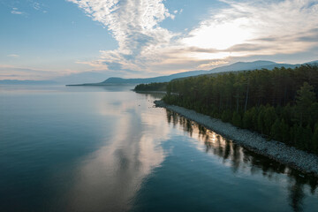 Summertime imagery of Lake Baikal in morning is a rift lake located in southern Siberia, Russia. Baikal lake summer landscape view. Drone's Eye View.