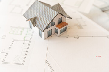 Design and construction of cottages. Layout and drawing of a country house. Architecture and construction. Layout of the house, boards. Private house.