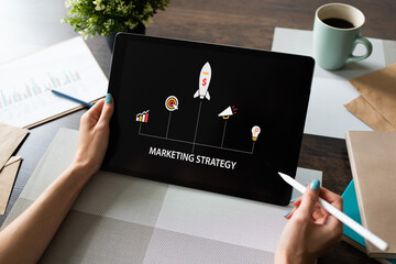 Wall Mural - marketing strategy diagram on device screen. business concept.