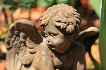 Sticker - Closeup shot of the angel stone statue under the sunlight