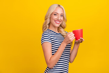 Poster - Photo portrait woman wearing casual clothes keeping mug of tea isolated vivid yellow color background