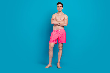 Sticker - Photo of confident nice guy folded arms shiny smile barefoot wear swimwear shorts isolated blue color background