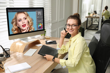 Poster - Professional retoucher working on graphic tablet at desk in office