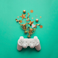 Wall Mural - Video game esports winning competition background. Game controller with gold winning trophy