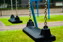 Closeup Shot Of Swings In The Playground