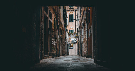 Poster - Beautiful narrow alleyway between buildings in an old urban city