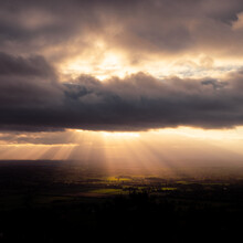 Malvern Hills View Of Dramatic Rays Of Light Shining On The English Countryside Below