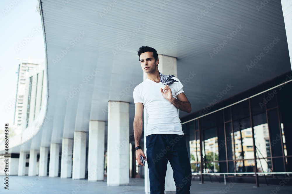 Contemplative hipster guy in casual apparel thoughtful looking away ...