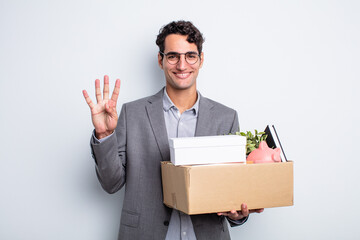 Wall Mural - young handsome man smiling and looking friendly, showing number four dismissal concept