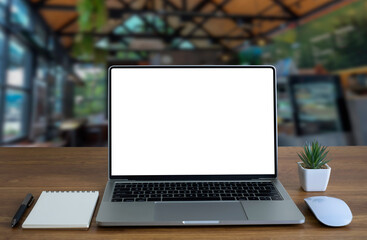 Front view of open laptop computer notebook with blank monitor white screen display on work table desk. Workspace office modern for job business online communication technology in shop or home indoor.