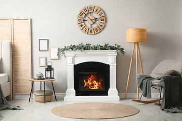 Poster - Stylish room decorated with beautiful eucalyptus garland on fireplace