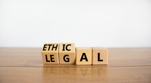 Ethical Or Legal Symbol. Turned Wooden Cubes And Changed The Word 'legal' To 'ethical' On A Beautiful Wooden Table, White Background. Business And Ethical Or Legal Concept. Copy Space.