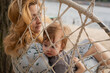 © rubchikova - Mother and daughter relaxing on the beach